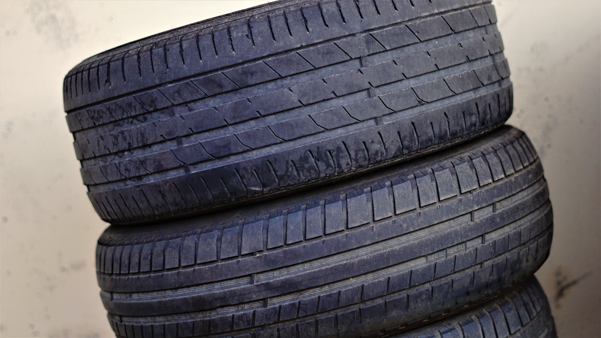 worn tires stacked for recycling worn down tires